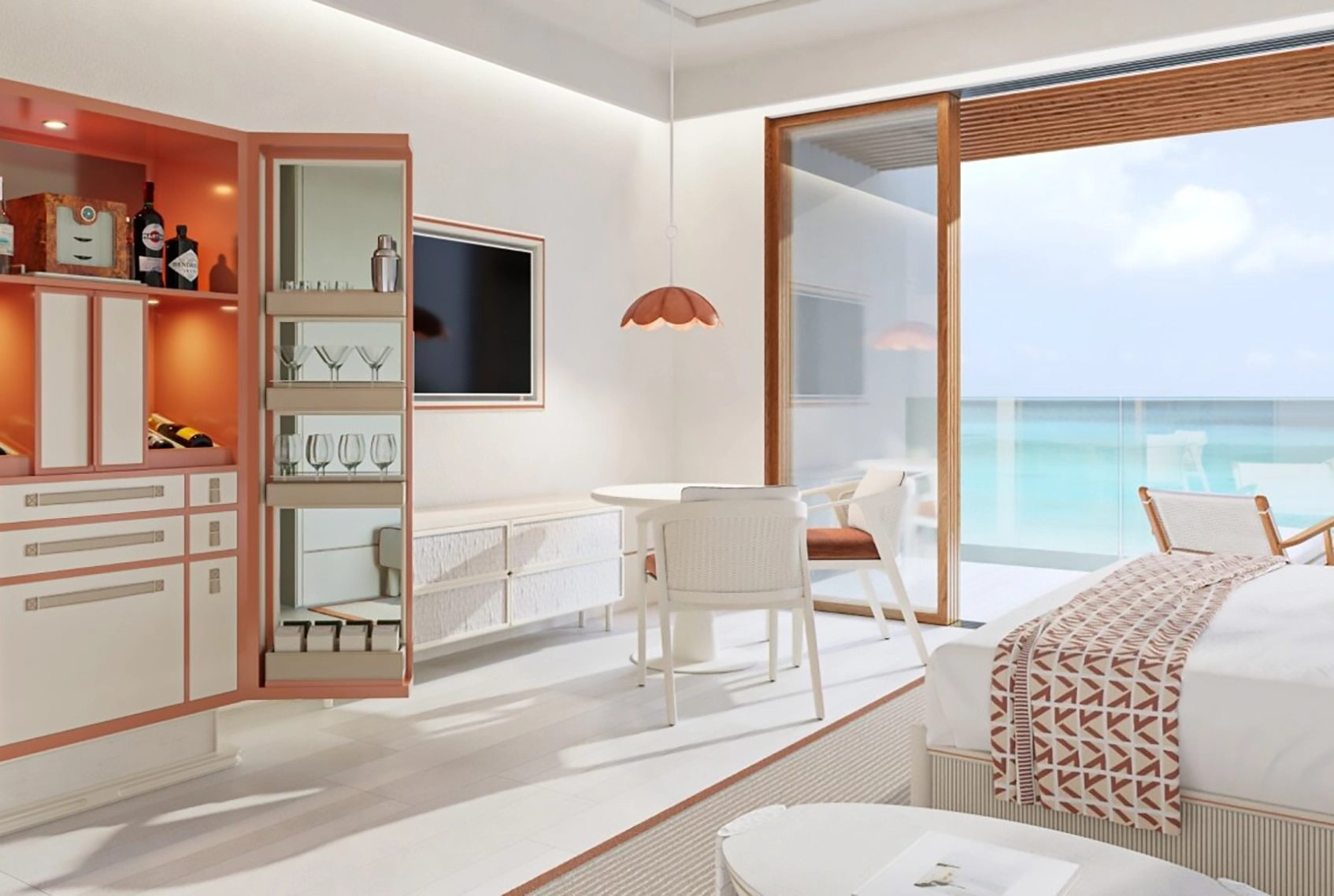 The Setai St. Marteen Pinel residence room with bedroom and balcony overlooking water